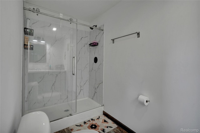 7376 Capac Rd, Yale, MI 48097 - bathroom featuring a marble finish shower, toilet, and baseboards