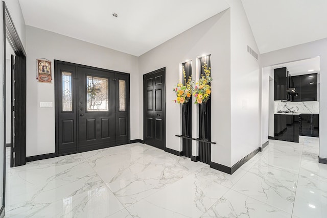 53242 Clarion Dr, Macomb, MI 48042 - entryway featuring light marble finish flooring and baseboards