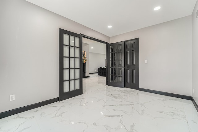 53242 Clarion Dr, Macomb, MI 48042 - spare room featuring baseboards, marble tiled flooring, french doors, and recessed lighting