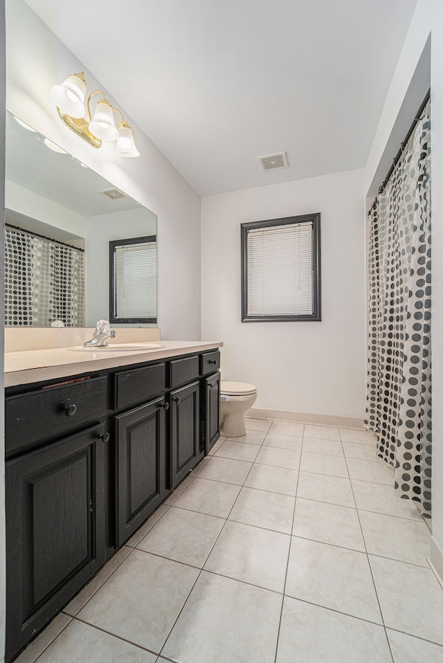 53242 Clarion Dr, Macomb, MI 48042 - full bathroom featuring toilet, tile patterned flooring, vanity, and baseboards
