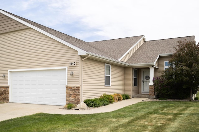 view of front of home with stone siding, roof with shingles, concrete driveway, a front lawn, and a garage