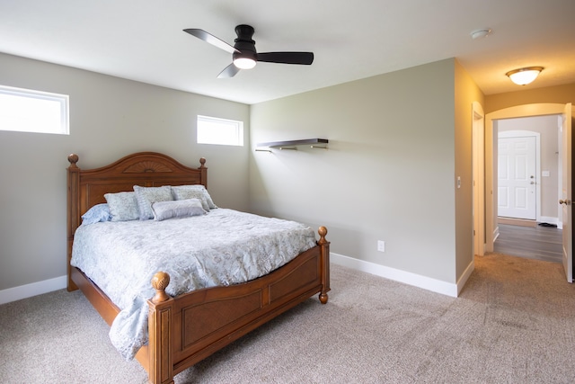bedroom with carpet floors, baseboards, and ceiling fan