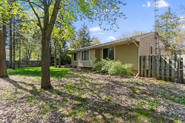 back of property with fence