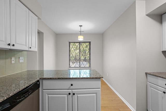 kitchen featuring dishwasher, light wood-type flooring, decorative backsplash, white cabinetry, and a peninsula