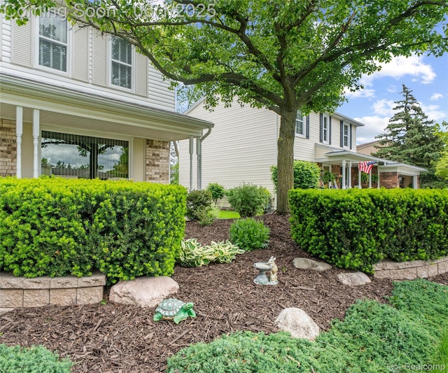 42736 Boulden Ct, Canton, MI 48187 - view of home's exterior with brick siding and a porch