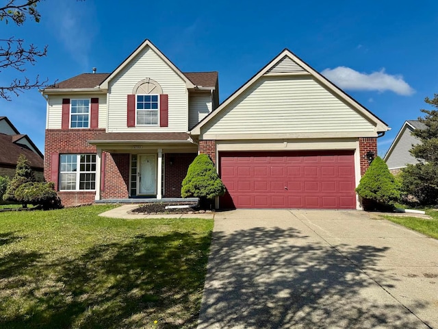 4158 Kimberly Dr, Canton, MI 48188 - traditional-style house featuring brick siding, a garage, driveway, and a front yard