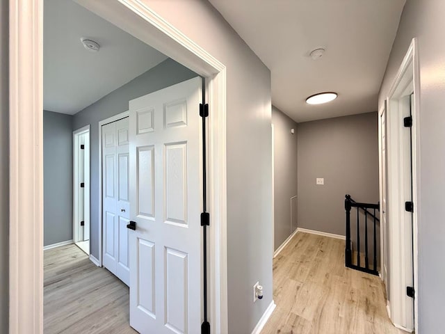 4158 Kimberly Dr, Canton, MI 48188 - hall with an upstairs landing, light wood finished floors, and baseboards