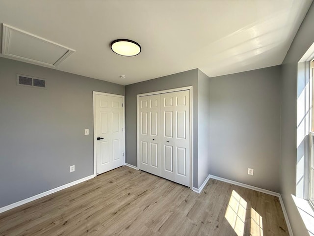 4158 Kimberly Dr, Canton, MI 48188 - unfurnished bedroom with baseboards, light wood finished floors, and a closet