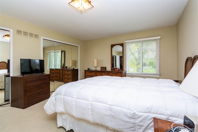5423 Hauser Way W, Bloomfield, MI 48323 - bedroom featuring light carpet and a closet
