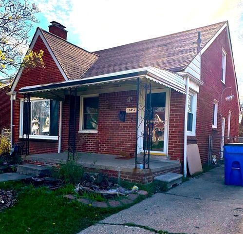 view of front of property featuring covered porch, brick siding, and roof with shingles
