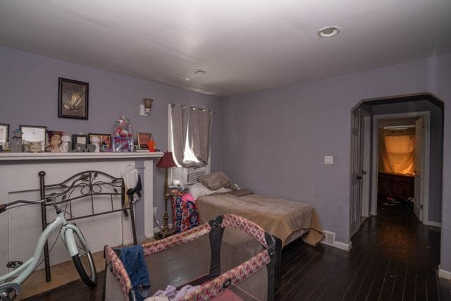 bedroom with wood-type flooring, baseboards, and recessed lighting