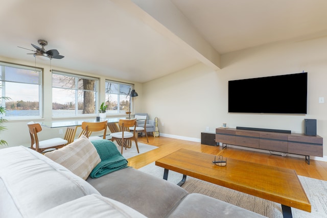 6340 Sporny Dr, Brighton, MI 48116 - living room with beamed ceiling, wood finished floors, a ceiling fan, and baseboards