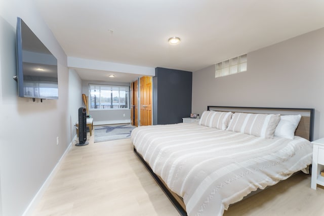 6340 Sporny Dr, Brighton, MI 48116 - bedroom with light wood-type flooring and baseboards