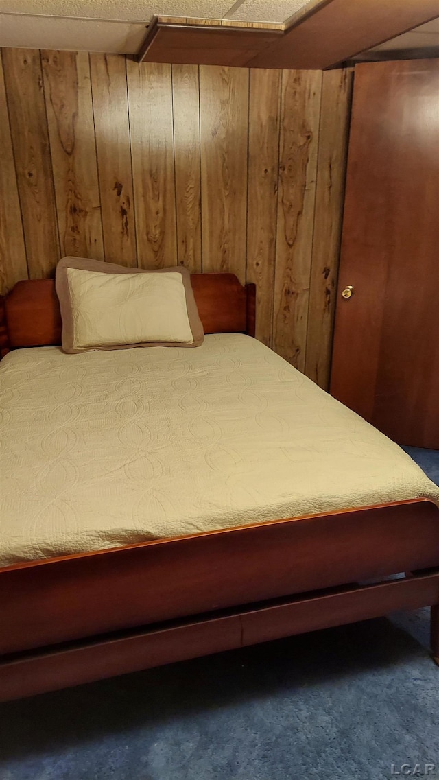 11800 N Adrian Hwy, Clinton, MI 49236 - bedroom with wooden walls and carpet flooring