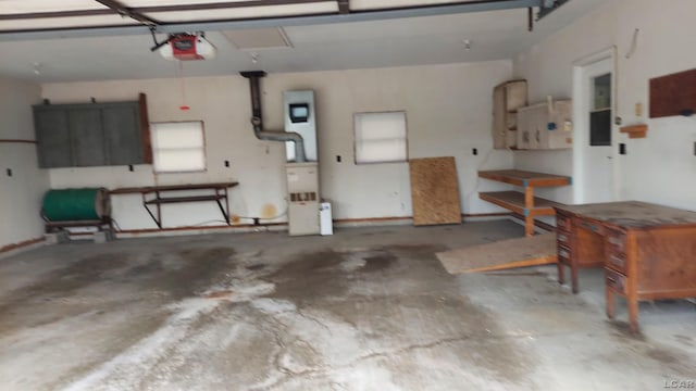 11800 N Adrian Hwy, Clinton, MI 49236 - garage featuring a garage door opener and electric panel