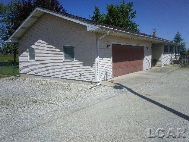 11800 N Adrian Hwy, Clinton, MI 49236 - view of home's exterior with a garage and driveway