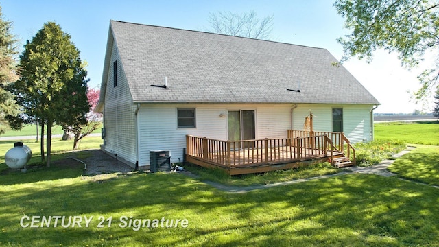 5530 Hess Rd, Saginaw, MI 48601 - rear view of house featuring a wooden deck, a lawn, central AC, and a shingled roof
