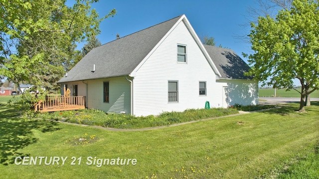 5530 Hess Rd, Saginaw, MI 48601 - view of side of home with a wooden deck, a lawn, and roof with shingles