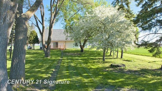 5530 Hess Rd, Saginaw, MI 48601 - view of green lawn featuring a deck