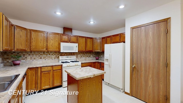 5530 Hess Rd, Saginaw, MI 48601 - kitchen with white appliances, tasteful backsplash, a sink, brown cabinets, and recessed lighting