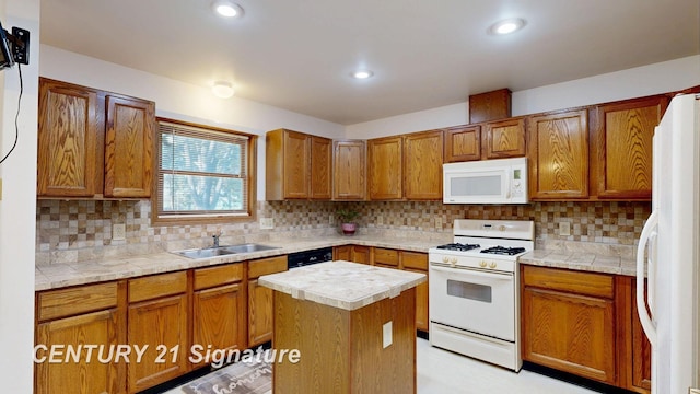 5530 Hess Rd, Saginaw, MI 48601 - kitchen with white appliances, a sink, brown cabinetry, tasteful backsplash, and recessed lighting