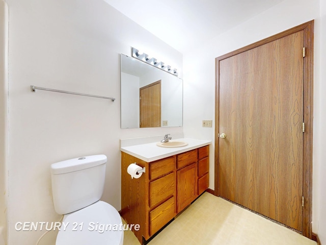 5530 Hess Rd, Saginaw, MI 48601 - bathroom featuring vanity and toilet