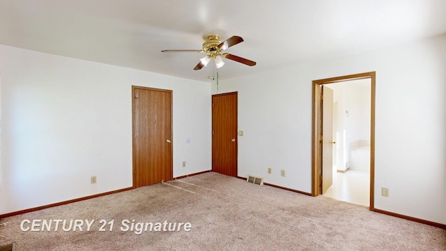 5530 Hess Rd, Saginaw, MI 48601 - unfurnished bedroom with carpet, ensuite bath, and a ceiling fan