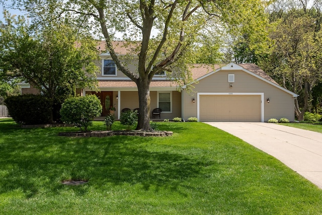 view of front facade with a garage, concrete driveway, a front yard, and a shingled roof