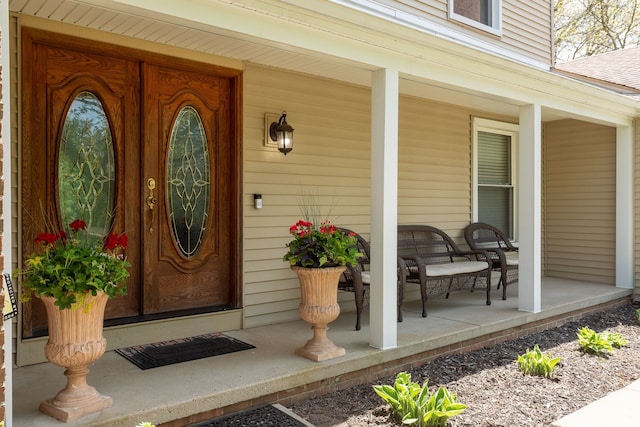 entrance to property featuring covered porch