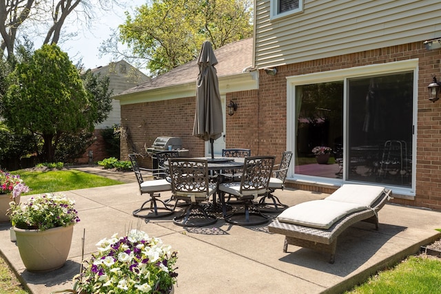 view of patio / terrace with outdoor dining area and grilling area