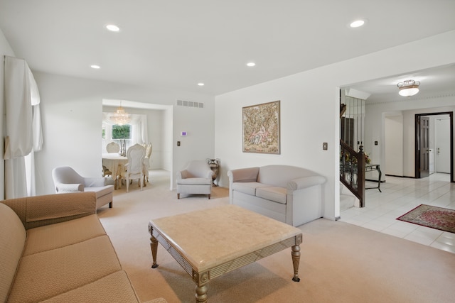 living area featuring light carpet, recessed lighting, light tile patterned floors, and stairs