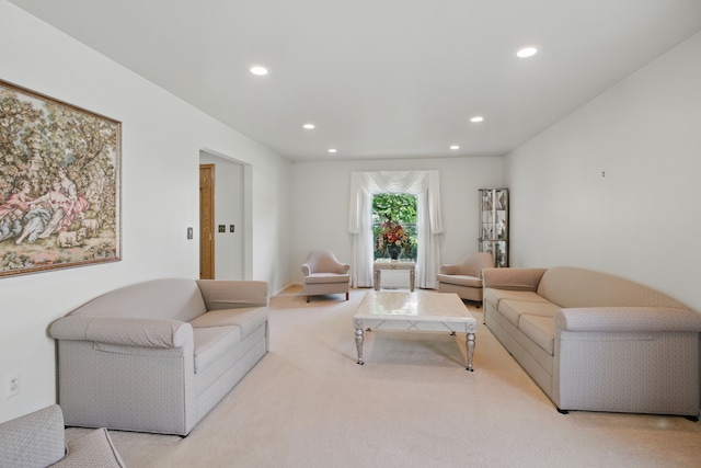 living room featuring recessed lighting and carpet