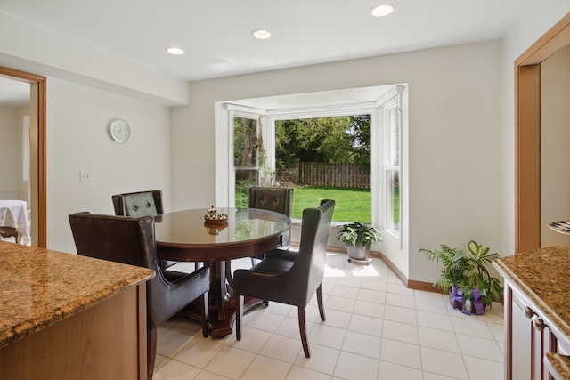 dining area featuring recessed lighting, baseboards, and light tile patterned floors