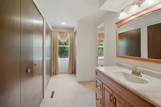 bathroom featuring vanity and baseboards