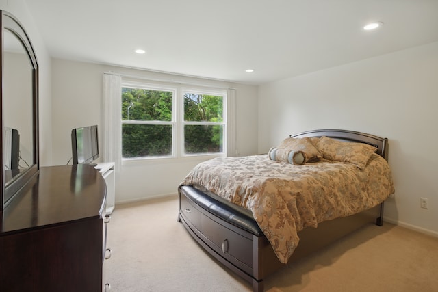 bedroom with light carpet, baseboards, and recessed lighting