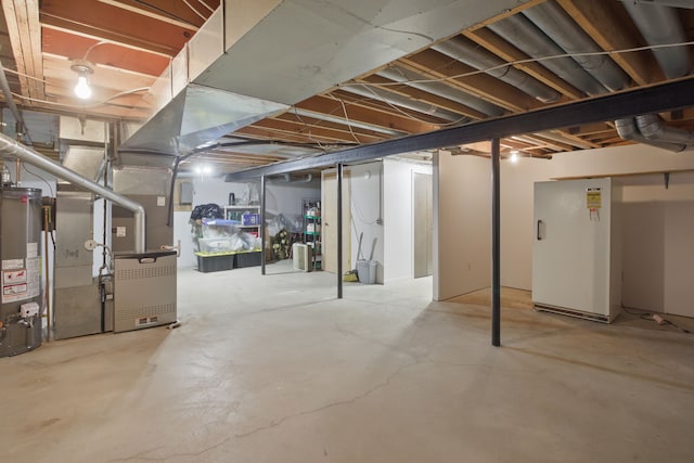 unfinished basement featuring water heater and heating unit