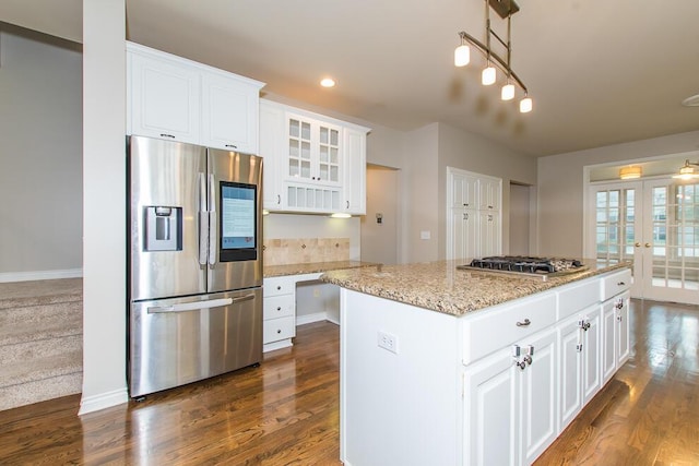 7294 Mackenzie Ln, Portage, MI 49024 - kitchen with stainless steel appliances, french doors, dark wood finished floors, glass insert cabinets, and white cabinets