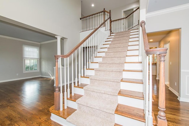7294 Mackenzie Ln, Portage, MI 49024 - stairs with ornamental molding, wood finished floors, baseboards, a towering ceiling, and recessed lighting