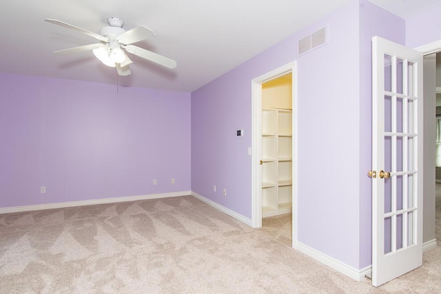 7294 Mackenzie Ln, Portage, MI 49024 - spare room with carpet floors, ceiling fan, and baseboards