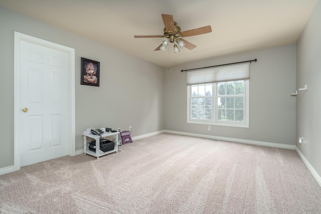 7294 Mackenzie Ln, Portage, MI 49024 - spare room with carpet, a ceiling fan, and baseboards