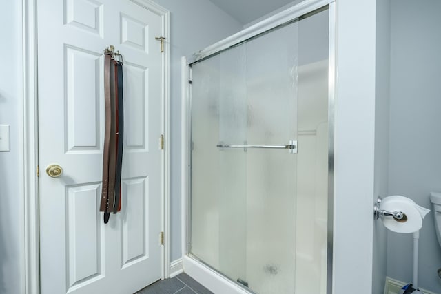 7294 Mackenzie Ln, Portage, MI 49024 - bathroom featuring a shower stall and baseboards