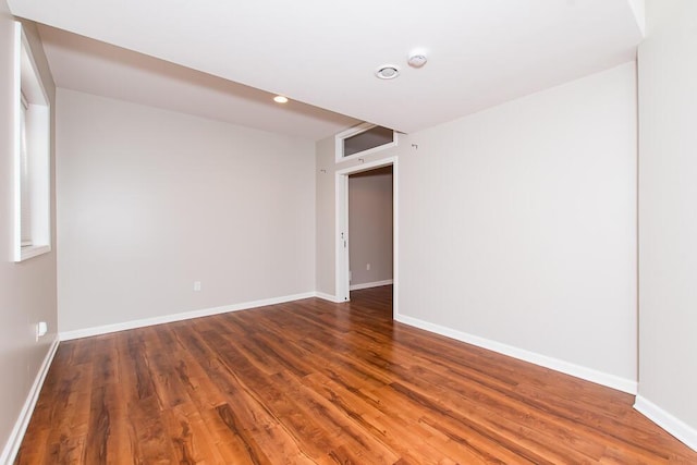 7294 Mackenzie Ln, Portage, MI 49024 - empty room featuring wood finished floors, baseboards, and a smoke detector