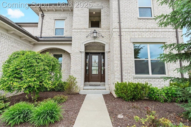10611 Stoney Point Dr, South Lyon, MI 48178 - view of exterior entry featuring brick siding