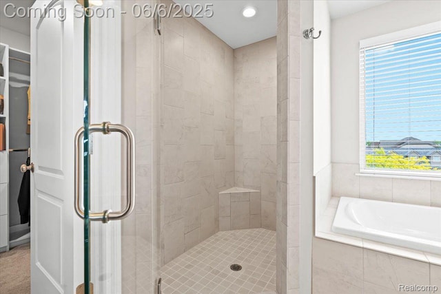 10611 Stoney Point Dr, South Lyon, MI 48178 - bathroom featuring a stall shower, healthy amount of natural light, and a garden tub