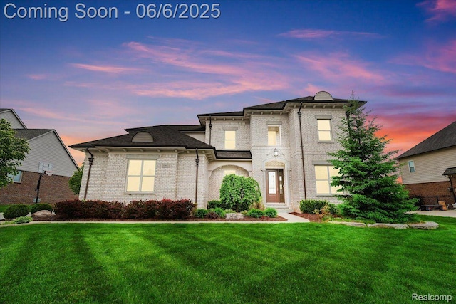 10611 Stoney Point Dr, South Lyon, MI 48178 - view of front facade with a lawn and brick siding