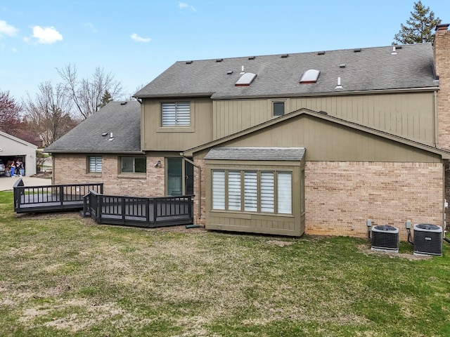 4206 Southmoor Ln, West Bloomfield, MI 48323 - rear view of property with brick siding, central AC, a wooden deck, a shingled roof, and a yard