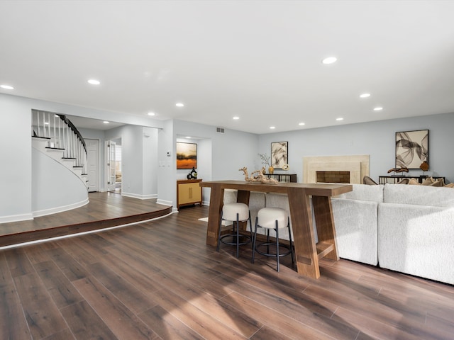 4206 Southmoor Ln, West Bloomfield, MI 48323 - bar area featuring stairway, dark wood-type flooring, recessed lighting, baseboards, and a fireplace