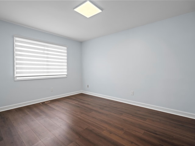 4206 Southmoor Ln, West Bloomfield, MI 48323 - empty room featuring dark wood finished floors and baseboards