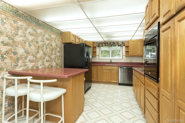 2982 Shawnee Ln, Waterford, MI 48329 - kitchen with dishwasher, open shelves, black fridge with ice dispenser, a sink, and a breakfast bar area