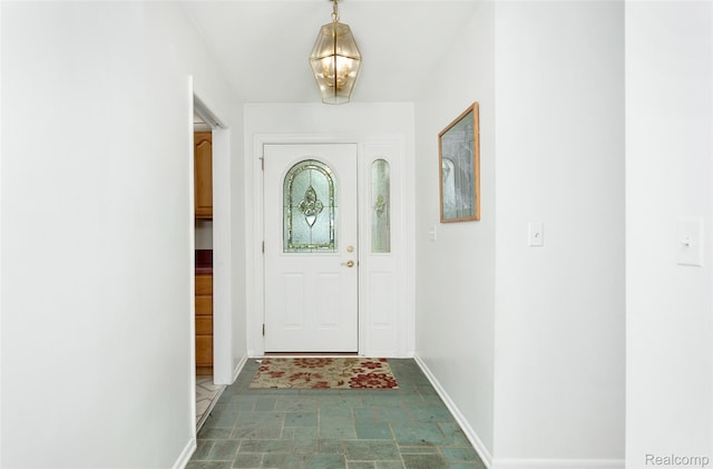2982 Shawnee Ln, Waterford, MI 48329 - entryway with baseboards and stone finish flooring